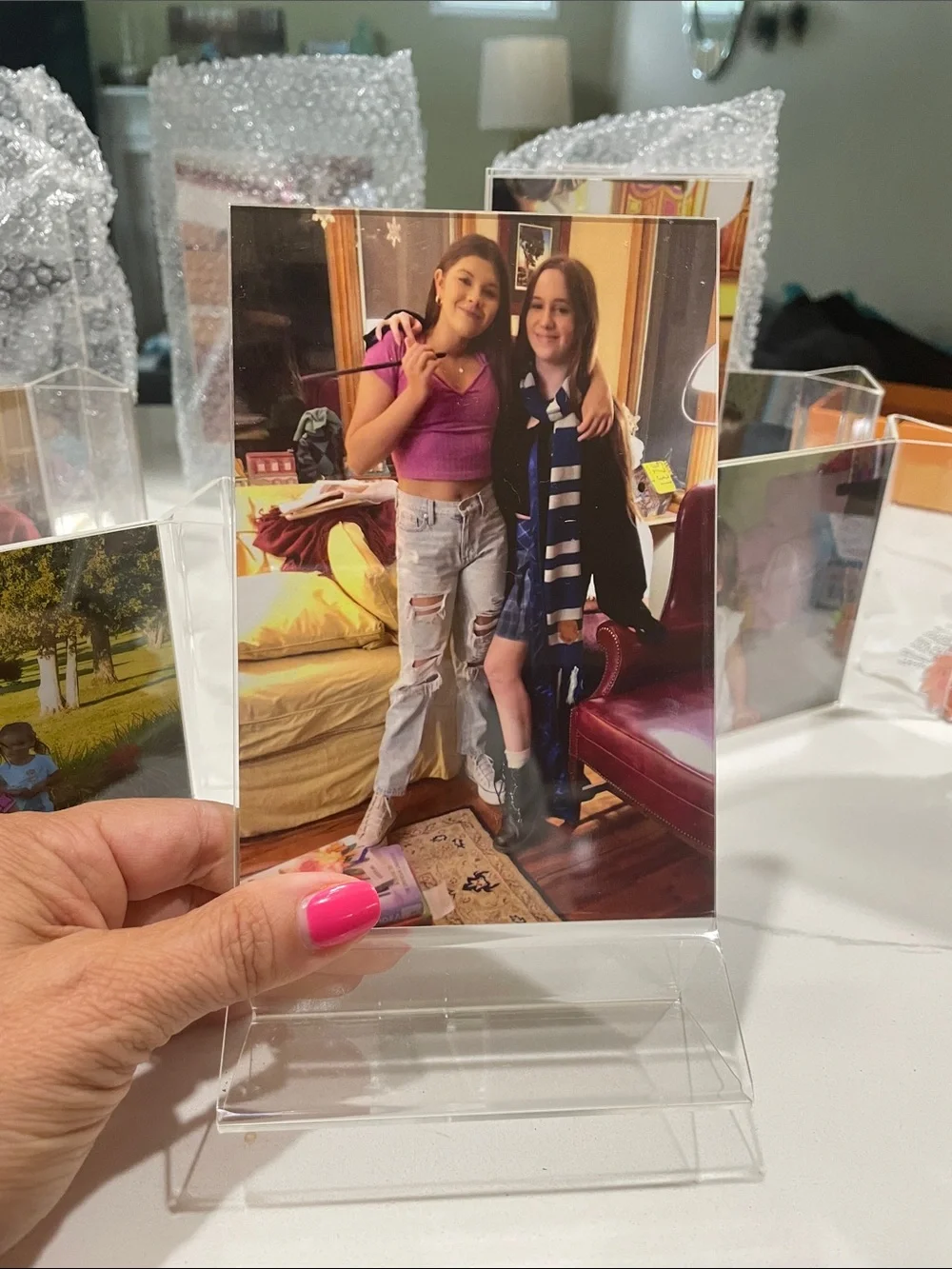 Clear Acrylic Multi-Photo Display Stand includes 12